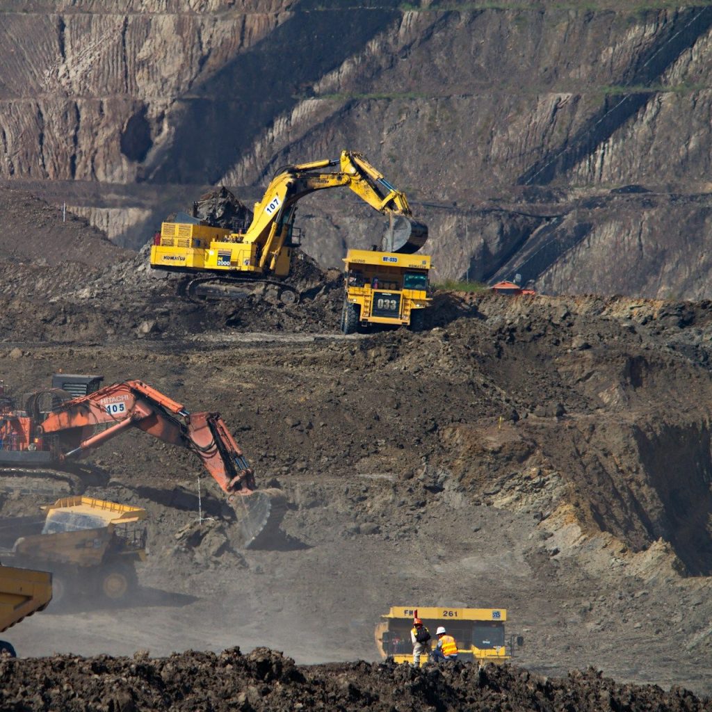 Mining Chemicals_ with diggers and trucks